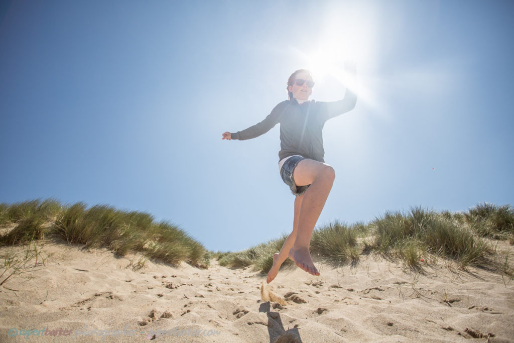 holywell sand dunes jumping girl