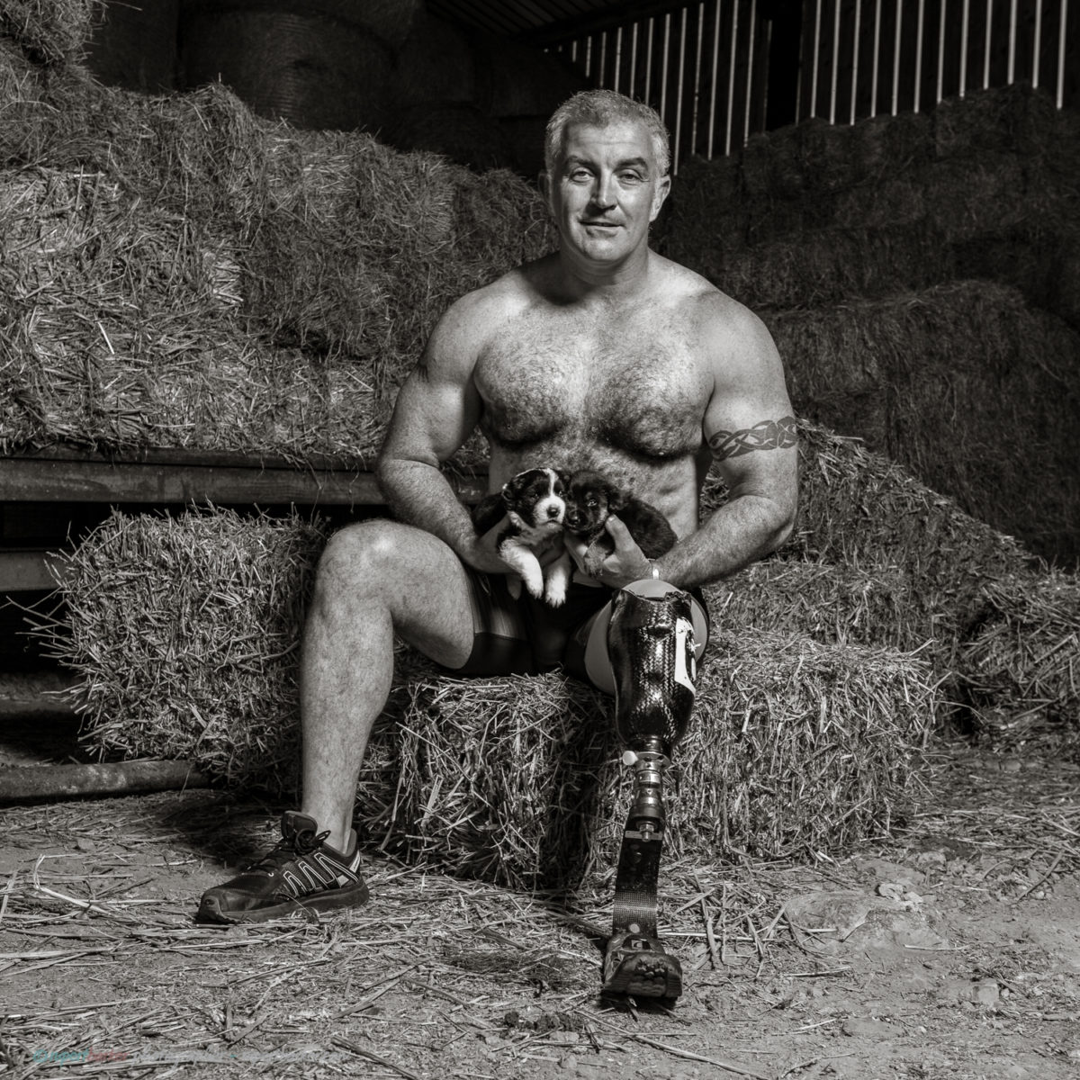 Topless Male Portrait with rescue puppies Black and White Calendar shoot